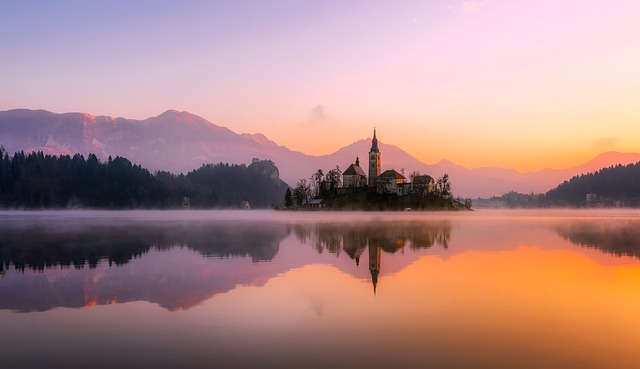 Bled Travel That looks almost unreal at dawn and equally lovely by dusk
